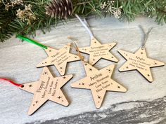 personalized wooden christmas ornament hanging from a tree