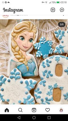 some cookies that are decorated to look like frozen princesses