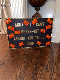 a sign that is on the floor in front of a door with orange stickers