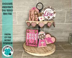 three valentine's day card holders on a stand with the words love and hearts