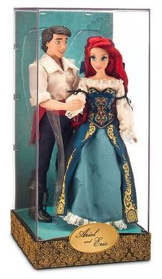 disney princess and prince figurines are in a glass case with the label on it