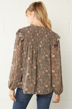 This top is so feminine, trendy & fun. We love the pretty floral print. It's simple, comfy & flowy fit make it so easy to style for work or play! This blouse features a split V-neckline with tie, long sheer sleeves with elastic at the wrist, ruffle detailing at the neck, is lined, has smocking on the shoulder area, is light weight and has a relaxed silhouette. Small Bust 42" Length 26" Medium Bust 44" Length 26" Large Bust 46" Length 26" 100% Polyester - No stretch hand wash or dry clean importe Blouse With Shorts, Kimono Jacket, V Neck Blouse, Sheer Sleeves, Large Bust, The Pretty, Floral Blouse, Small Bust, Destiny