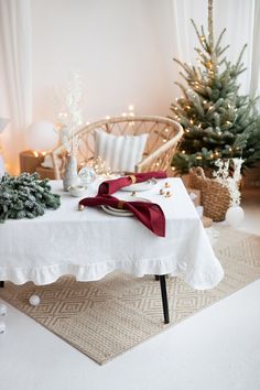 the table is set up for christmas dinner