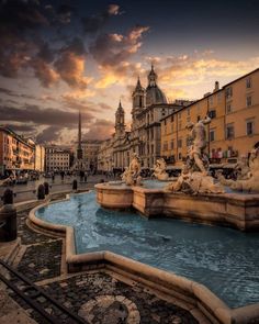 a fountain in the middle of a city square