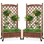 two wooden planters with green plants in them and wheels on the sides, both side by side