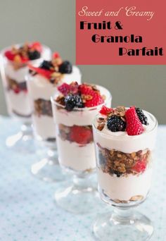 three glasses filled with fruit and granola parfait on top of a table