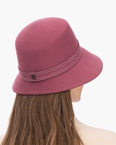 A fashionable women's cloche hat is hand-blocked of the finest superfelt, and then trimmed with a contrast stitch matching band of the same. The ultra sleek silhouette features a rakishly downturned brim, bringing focus to the eyes while framing the face beautifully. Brim span center front: 2.75"(7cm) side: 3"(7.5cm) Designed and finished in the USA Hand-blocked by skilled artisans Sustainable wool and cashmere blend superfelt Elasticized sweatband Adjustable head-size with hidden velcro® featur Formal Brimmed Fedora, Fall Wide Brim Fur Felt Cloche Hat, Fall Cloche Hat With Short Brim In Fur Felt, Wide Brim Wool Cloche Hat, Wool Wide Brim Cloche Hat, Fur Felt Cloche Hat With Short Brim For Fall, Adjustable Fur Felt Cloche Hat With Flat Brim, Chic Brimmed Cloche Hat, Wide Brim Fur Felt Hat