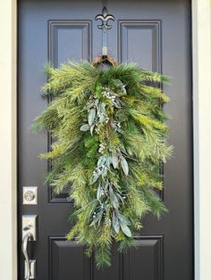 a wreath is hanging on the front door