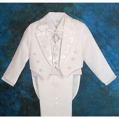 a white tuxedo suit and bow tie with sequins