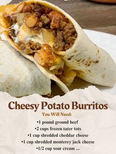 a burrito with meat and cheese on it