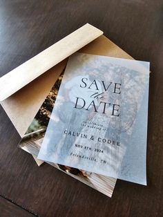 save the date cards are stacked on top of each other with envelopes attached to them