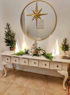 a white table topped with lots of christmas decorations