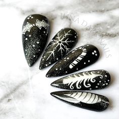 "Welcome to LD Nails!  Hi, I'm Bur and I'll be your long distance nail ghoul 😜 Read on for the obligatory written description of what you see in the pictures, plus some other important stuff..  🖤 One set of 10 REUSABLE Press On Nails 🖤 Christmas Globes: black gothic Christmas press on nail set with hand painted black and white festive Christmasy details under a silver cat eye that has been manipulated to resemble to glitter in a snow globe!  👉 Please leave your finish preference and (if applicable) custom sizing in the personalization box!  Est. 2020: LD Nails specializes in custom Gothic, Witchy and Alternative Press On Nails. I draw inspiration from what I love, so you'll find heavy gothic influences to much of the offerings in my shop!  5 ⭐️ Rating on Etsy & 1000's of orders shipped Glitter Christmas Nails, Nails Witchy, Silver Cat Eye, Gothic Christmas, Christmas Globes, Nails Christmas, Snowflake Nails, Silver Cat, Christmas Nail Designs