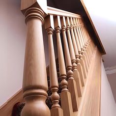 an image of a wooden staircase with handrails