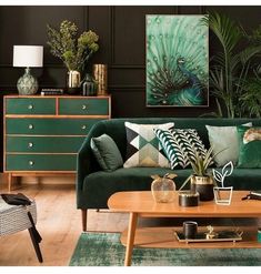 a living room filled with green furniture and lots of plants on top of the table