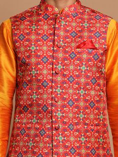 VASTRAMAY Maroon Patola Print Nehru Jacket With Orange kurta Pyjama Set Make a style statement with this elegant Nehru jacket paired with a vibrant orange kurta pyjama set from VASTRAMAY. The maroon patola print adds a touch of sophistication, perfect for festive occasions or cultural events. Features: Maroon Patola Print Nehru Jacket Orange Kurta with Pyjama Set Elegant and Stylish Design Perfect for Festive Occasions Specifications: Brand: VASTRAMAY Color: Maroon and Orange Print: Patola Style Anarkali Cotton Silk Sherwani For Festivals, Festival Zari Work Straight Kurta Outerwear, Traditional Stand Collar Outerwear For Festive Occasions, Traditional Festive Outerwear With Stand Collar, Cotton Silk Bandhgala For Designer Wear, Traditional Stand Collar Festive Outerwear, Traditional Outerwear For Festive Occasion, Traditional Festive Outerwear For Transitional Season, Traditional Outerwear For Festive Transitional Season