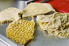 some kind of food that is sitting on a pan and ready to be cooked in the oven