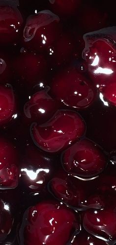 the liquid is being poured on top of cherries