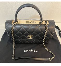 Elevate your style with this stunning CHANEL Classic Crossbody bag. Good condition but had some minor signs of use (see pics) Including on the gold accent. Crafted from high-quality black leather, this large-sized bag features a rectangular shape with a turn lock closure. The bag comes with a leather handle/strap that adds a touch of elegance to the overall design. The interior of the bag is lined with black and features a grained and stamped finish. It also has gold hardware accents that complement the overall look of the bag. This CHANEL Classic Crossbody bag is perfect for women who want to add a touch of sophistication to their outfit. Classic Crossbody Bag, Gold Accent, Leather Handle, Large Black, Chanel Classic, Gold Hardware, Bags Handbags, Crossbody Bag, Shoe Accessories