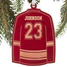 a hockey jersey ornament hanging from a christmas tree