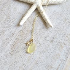 "This lovely cultured sea glass pendant & starfish necklace is ideal for the beachy gal. It comes in your choice of a light sea foam green, a brighter autumn green or a soft lemon yellow. You can select from either a gold filled chain with gold starfish or sterling silver chain with sterling starfish Comes in 16\" or 18\" lengths. **Sea glass comes in assorted shapes and sizes and are randomly picked. Please see photo of shapes for each color** Starfish is 8x8mm in size Sea glass sizes are 8 Dainty Starfish Necklace For Beach, Beachy Starfish Necklace For Gift, Beachy Starfish Necklace Gift, Star Charm Necklace For Beach, Star Charm Necklaces For Beach, Beach Jewelry With Star Charm Pendant, Gold Necklace With Recycled Glass For Gifting, Gold Necklace With Recycled Glass For Gifts, Autumn Green