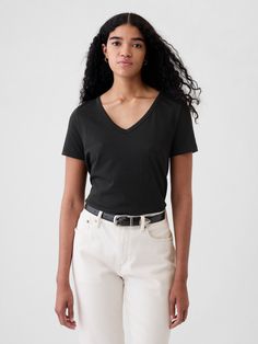 Made with 100% organically grown cotton.  Organic cotton is better for people and the environment because it’s grown without the use of harmful synthetic pesticides and fertilizers.  Short sleeves.  V-neck.  Straight silhouette with a relaxed fit.  Hits at the hip.  Nissa is 5’9. 5”/177cm with a 31”/79cm chest, 24”/61cm waist, 35”/89cm hip wearing a regular Gap Gap T-shirt For Everyday Spring Wear, Gap Organic Cotton Short Sleeve Top, Casual Organic Cotton T-shirt By Gap, Casual Gap Organic Cotton T-shirt, Gap Casual Organic Cotton T-shirt, Everyday Black Tops By Gap, Black Relaxed Fit Top By Gap, Black Relaxed Fit Top From Gap, Everyday Black Top By Gap