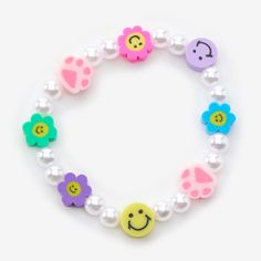 This cute bracelet is sure to bring a smile to your face! The Fimo clay beads alternate with shiny faux pearls on this elastic stretch bracelet. Stretch fit Material: Fimo clay - Claire's Happy Smiles Beaded Stretch Bracelet Kids Stretch Bracelets, Playful White Plastic Jewelry, Cute Beaded Plastic Stretch Bracelet, Playful Plastic Beaded Bracelets, Cute Adjustable Plastic Stretch Bracelet, Playful Plastic Stretch Bracelet With Round Beads, Playful Round Bead Stretch Bracelet, Playful White Plastic Stretch Bracelet, Kids Toys For Christmas