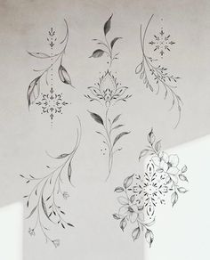 the wall is decorated with flowers and leaves in black and white ink on gray paper