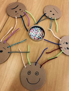 the paper plate puppets are made to look like children's faces with sprinkles on them