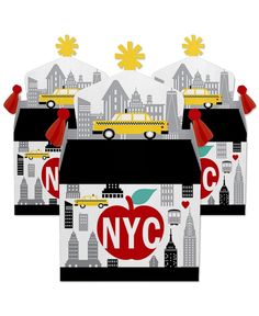 three new york city themed gift bags with red bows and yellow school bus on them