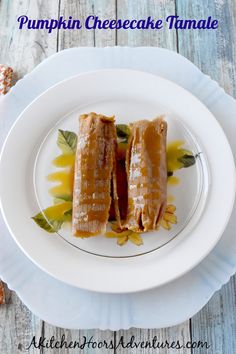 two pieces of cake sitting on top of a white plate next to an orange flower