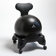 an exercise ball sitting on top of a black chair that is attached to the back of it