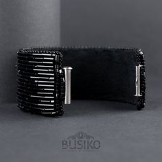 Wide black cuff bracelet with silver bead strips for lovers of statement exclusive jewelry. This jewelry is created for those who prefer chic in modern style. If you are brave and are not afraid of experimenting with your style, then this is a elegant accessory for you. These beautiful bracelet you can wear with elegant dresses or with clothes of different style. He just as perfectly meet to outfit for a evening celebration. This bracelet are totally handmade by the author's sketches and embroid Handmade Cuff Bracelets For Party, Handmade Adjustable Beaded Bracelets For Formal Occasions, Handmade Luxury Silver Beaded Bracelets, Luxury Handmade Silver Beaded Bracelets, Modern Handmade Beaded Bangle Bracelets, Elegant Beaded Cuff Bracelets, Handmade Wearable Art Bracelets For Party, Handmade Wearable Art Bracelet For Party, Handmade Cuff Bracelets For Formal Occasions