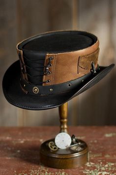 Hand Crafted Leather Premium Quality Leather Hat , Each Hat is Hand made  Description: Hat is sended in flyer to sending in box there will be extra charges of 25 dollars  we have multiple options in leather Color : Black , Dark Brown , Distress Brown , White , Silver , Maroon Redish  , Greenish Green ,  Tan Brown * High-Quality Craftsmanship handmade * Real Leather * 100% pure leather Sizing: XS 54 CM S 55-56 CM M 57-58 CM L 59 CM XL 60 CM XXL 61-62 CM Heads come in all sizes, and in a lots variety of shapes. Although high quality hats are adaptable, and will usually conform to differences in shape with a little wearing, it is essential that the size be correct for the head. To determine your hat size, measure the circumference around your head, keeping the tape level and firm, across the Victorian Vest, Brown Leather Hat, Moda Steampunk, Corset Steampunk, Leather Top Hat, Steampunk Top, Brown Leather Top, Steampunk Top Hat, Steampunk Hat