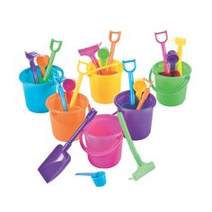 several buckets and shovels are lined up in a row on a white background