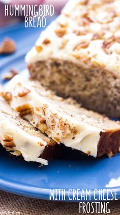 a loaf of banana nut bread on a blue plate with walnuts around the edges