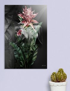 there is a potted plant with flowers on it next to a wall mounted canvas