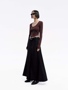 MO&Co. Women's Wool Blend Maxi Skirt A transitional wardrobe staple, this knitted midi skirt is crafted from a wool blend, lending the knit a subtle sheen. It features a high waist and inner inverted pleats at the front that create a graceful, flowing hem. Perfectly paired with our matching top for a chic and coordinated look. Please note, the waist belt is not included. Features : - High waist A-line maxi silhouette- Side pockets, front inner pleats- Button and zip closure Code: MBD1SKT034The b Knitted Midi Skirt, Waisted Skirts, Curved Neckline, Knit Midi Skirt, Cropped T Shirt, Knit Midi, Gray Skirt, Knit Crop, Metal Logo