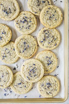 freshly baked cookies with lavender sprinkles on a baking sheet, ready to be eaten