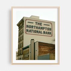 the sign for the northampton national bank is displayed in front of an old building