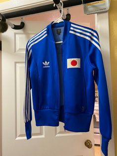 Adidas Windbreaker Jacket, Adidas Long Sleeve Windbreaker With Three Stripes, Adidas Red Streetwear Outerwear, Adidas Vintage Jacket, Adidas Classic Shoes, Vintage Blue Adidas Jacket, Adidas Originals Jacket, Retro Shoes