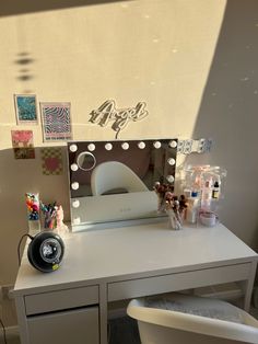 a desk with a mirror and various items on it