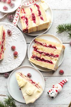 three slices of cake on white plates with christmas decorations