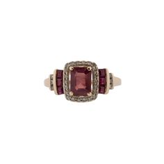 This stunning natural ruby and diamond ring is the perfect way to show your unique style. Featuring .14ctw single cut diamonds, .50ctw square step cut rubies and a .50ct center natural light flux treated ruby, this ring will make a bold statement. Crafted from 14k rose gold for a beautiful finish, this ring will be sure to stand out. The ring is currently a size 7, and can be adjusted to fit your finger for a small fee. Ruby Jewelry With Diamond Accents In Baguette Cut, Baguette Cut Ruby Jewelry With Diamond Accents, Red Baguette Cut Diamond Accent Rings, Red Emerald-cut Diamond Accented Jewelry, Rectangular Ruby Ring Fine Jewelry, Red Emerald-cut Rings With Diamond Accents, Ruby Jewelry With Diamond Accents, Emerald Cut, Rectangular Ruby Ring In Fine Jewelry Style, Emerald Cut Ruby Jewelry With Diamond Accents