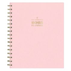 a pink planner book with gold foil lettering