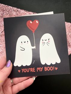 someone is holding up a card with two ghostes and a heart on it that says, you're my boo