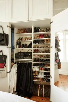 an organized closet with shoes, handbags and purses