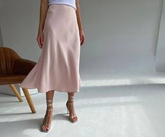 Silk slip skirt pink beige elegant skirt Silk slip skirt High waisted skirt midi skirt lightweight skirt satin skirt pink silk satin skirt ⭐Size: Since we work with custom orders, the length of each skirt may vary slightly depending on the customer's height🙌 The length of the skirts from waist to bottom is always in that range: 🔹Mini skirt 14-18 inches. 🔹Midi skirt 19-28 inches. 🔹Maxi skirt from 29 inches and up to the floor ❤️❤️When you place the order, please write your measurements of the Pink Silk Midi Skirt Outfit, Pink Satin Skirt For Spring, Feminine Satin Skirt For Spring, Feminine Pink Satin Bottoms, Pink Satin Lined Skirt Bottoms, Elegant Pink Satin Skirt, Elegant Pink Satin Bottoms, Silk Midi Skirt For Spring, Spring Satin Full Skirt