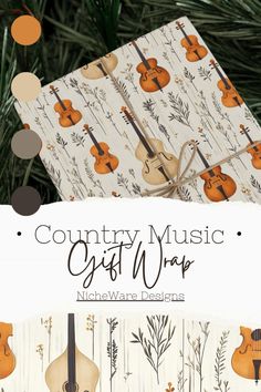 the country music gift wrap is shown in front of a christmas tree with musical instruments on it