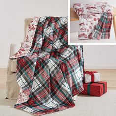 a plaid blanket is sitting on the floor next to boxes and a christmas present box